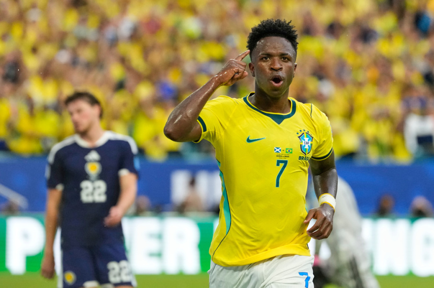 Vinícius Júnior scores 2 goals as Brazil beats Scotland 3-0 to reach World Cup knockout stage